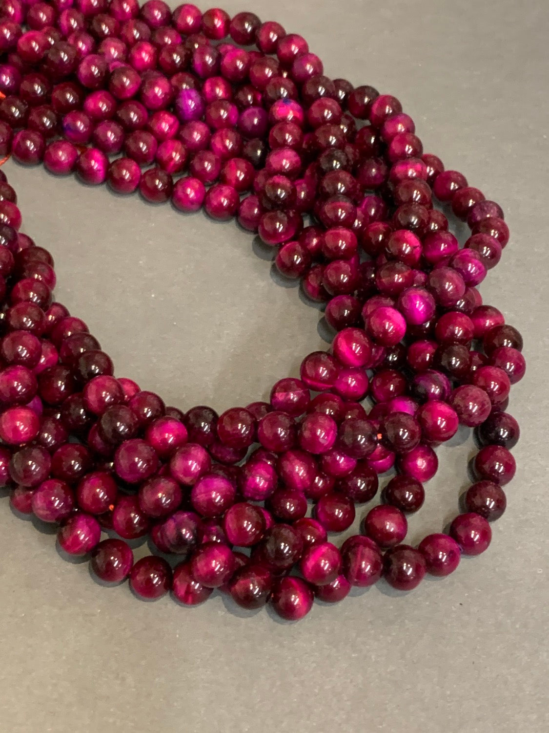 8mm magenta tiger eye / Ojo de Tigre 20619