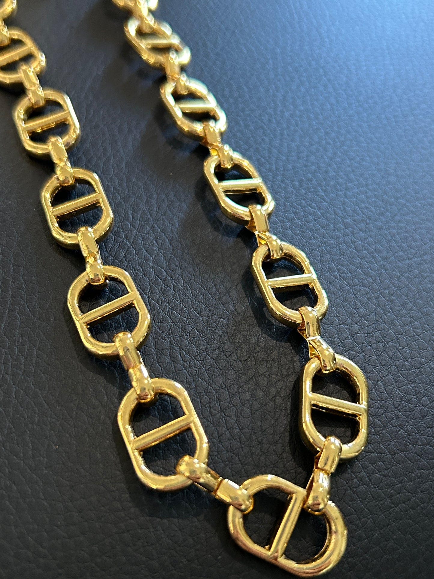 14k Oval chain by feet. (SBM)