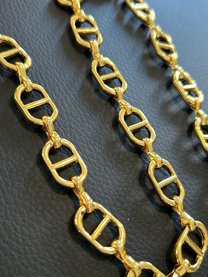 14k Oval chain by feet. (SBM)