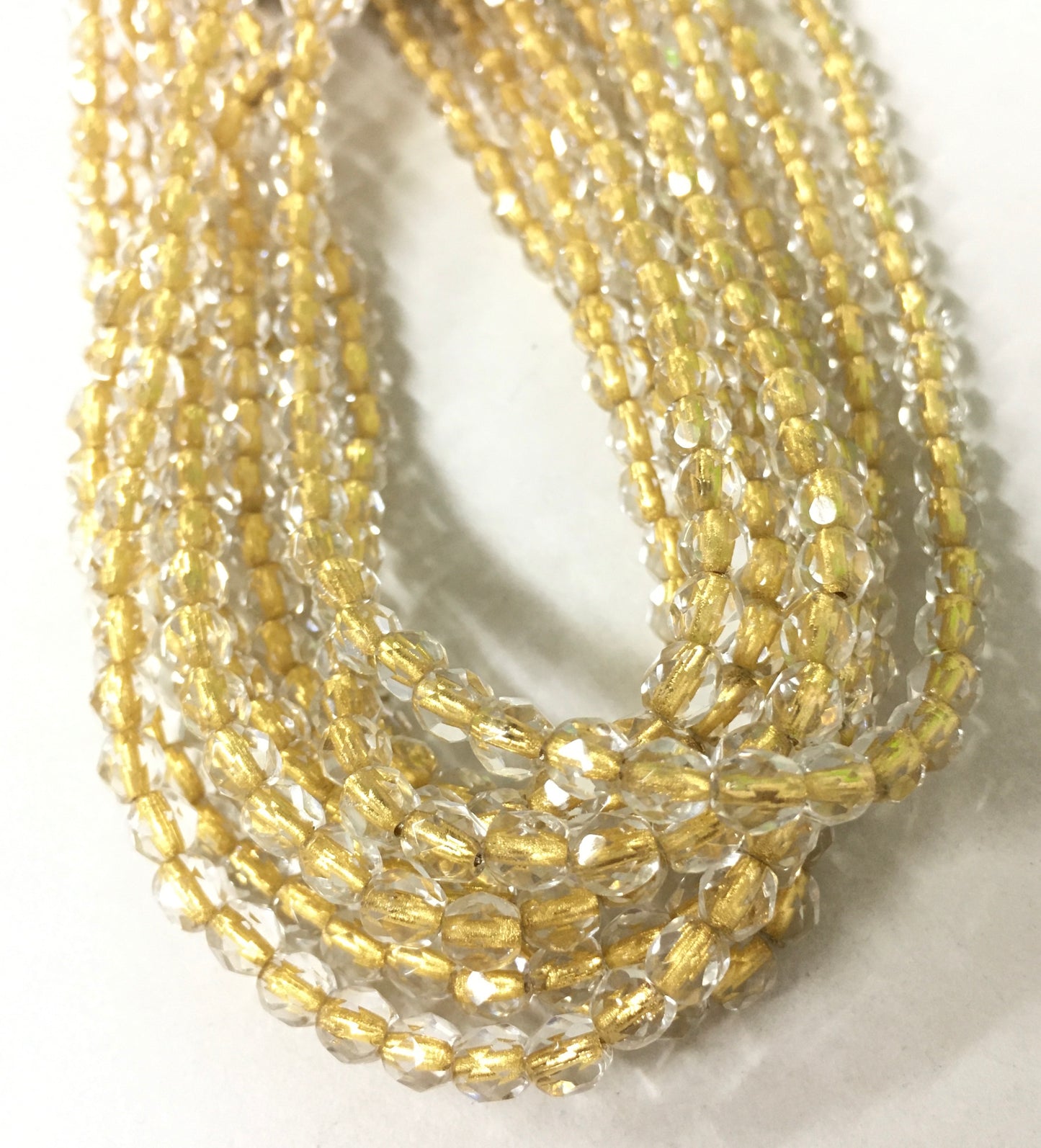 4mm Clear and Gold Round Faceted Czech Strand / Redondo