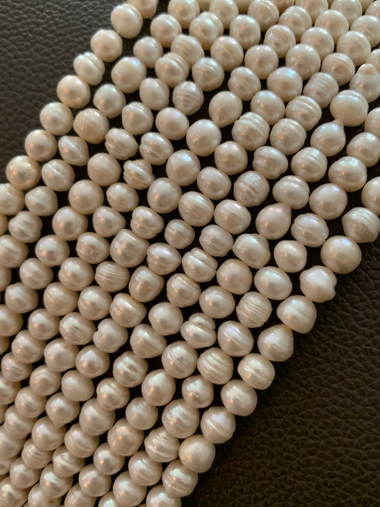 7.5 to 8mm  round puffy freshwater pearl qty 52 pearls 20908