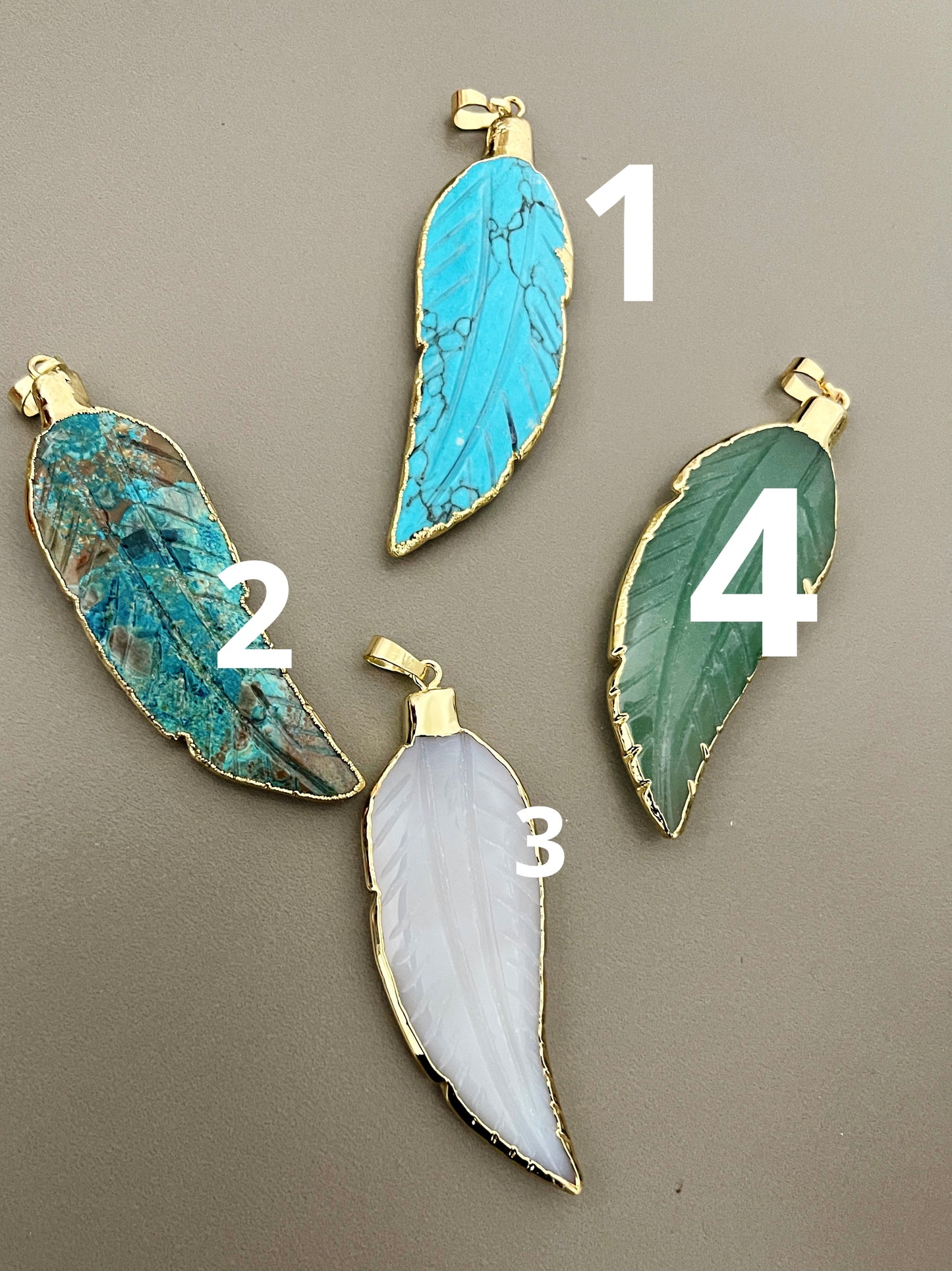 Gemstone leaf pendant with 18k around