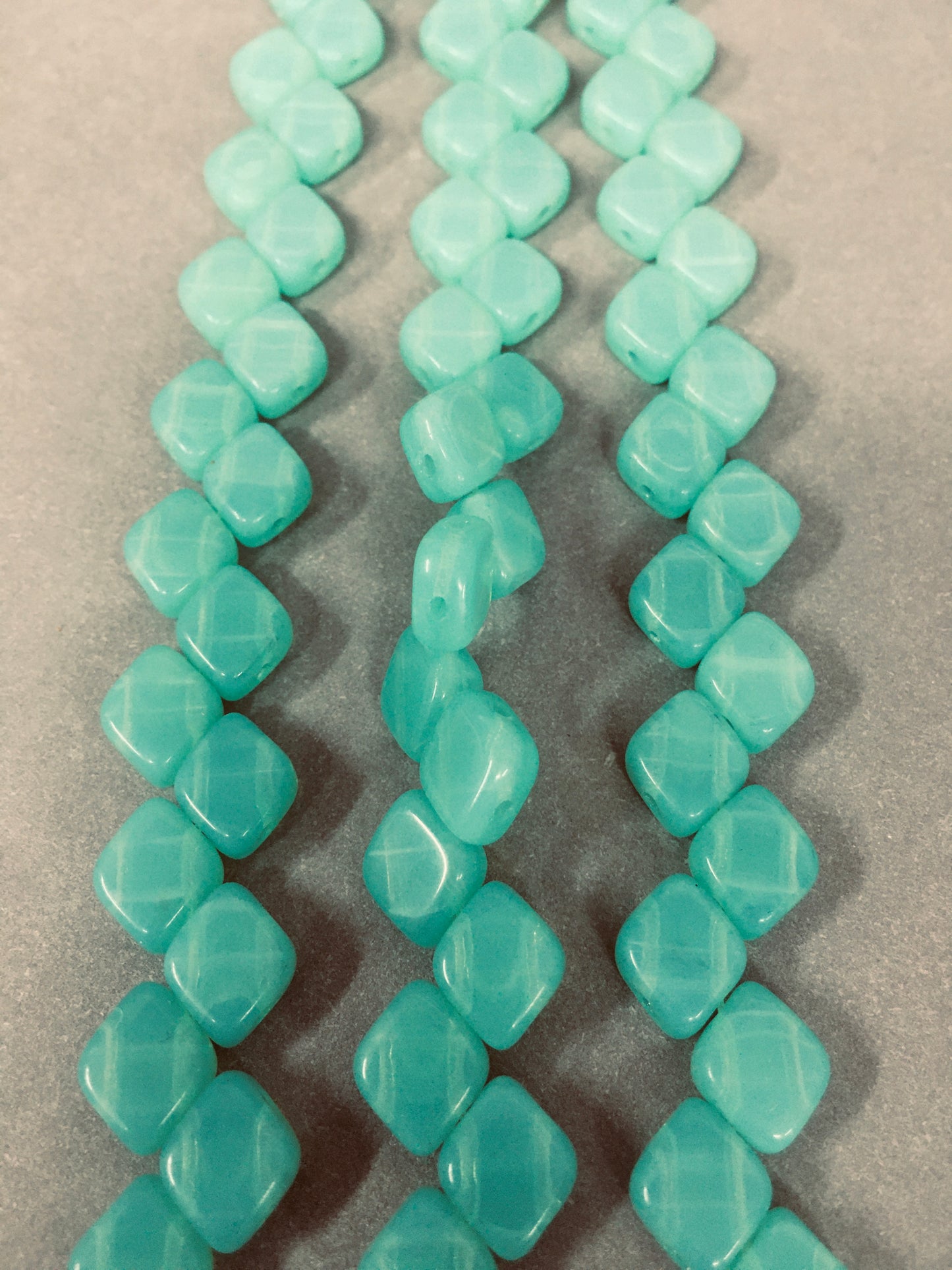 10mm Aqua Sideways 4 Hole Czech Strand / Diamante Cuadrado