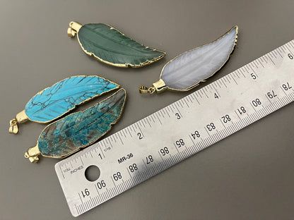 Gemstone leaf pendant with 18k around